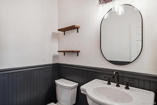 bathroom with sink and toilet