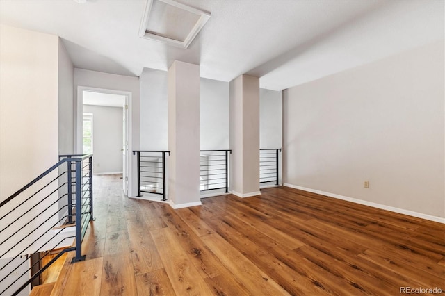 spare room featuring wood-type flooring