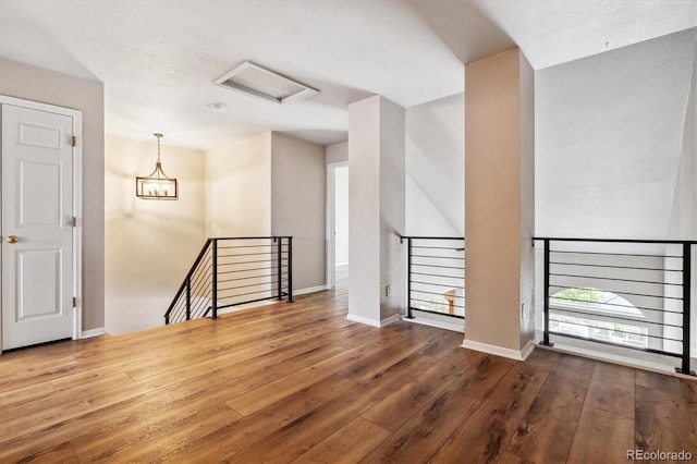 unfurnished room with wood-type flooring