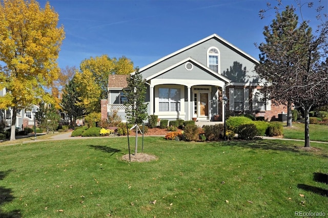 view of front of property with a front yard and a porch