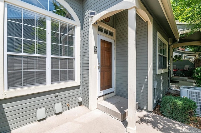 entrance to property featuring central AC