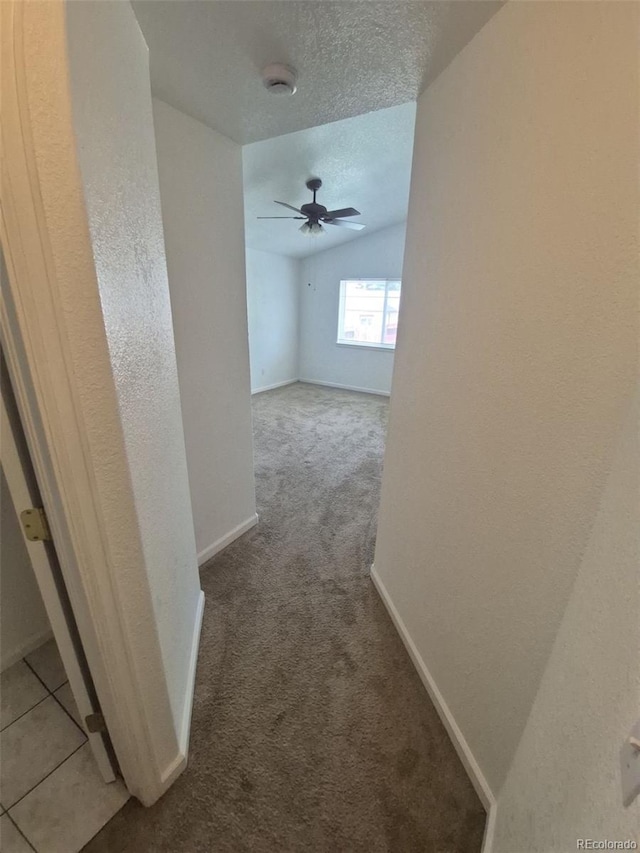 894 S Krameria St, Denver, CO 80224 - hallway with a textured ceiling, carpet, and baseboards