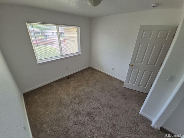894 S Krameria St, Denver, CO 80224 - unfurnished room with carpet floors and baseboards