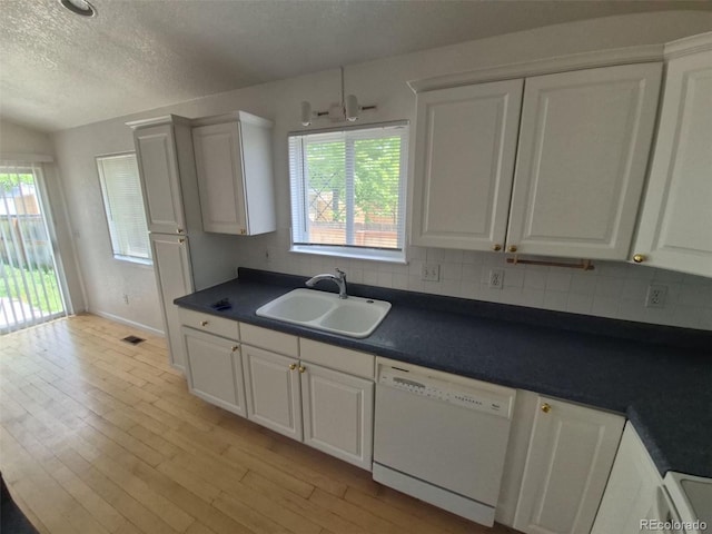 894 S Krameria St, Denver, CO 80224 - kitchen with white dishwasher, a sink, a textured ceiling, and white cabinets