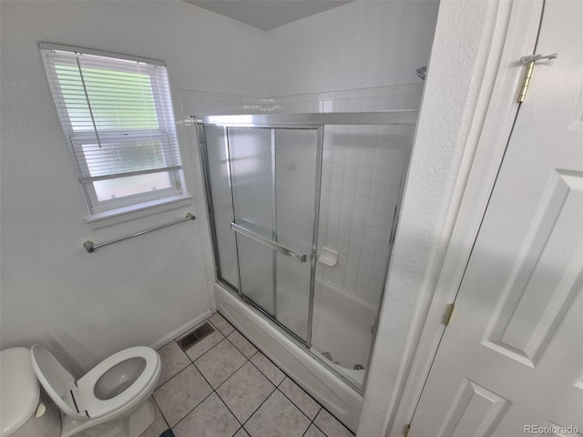 894 S Krameria St, Denver, CO 80224 - bathroom with toilet, a shower stall, and tile patterned floors