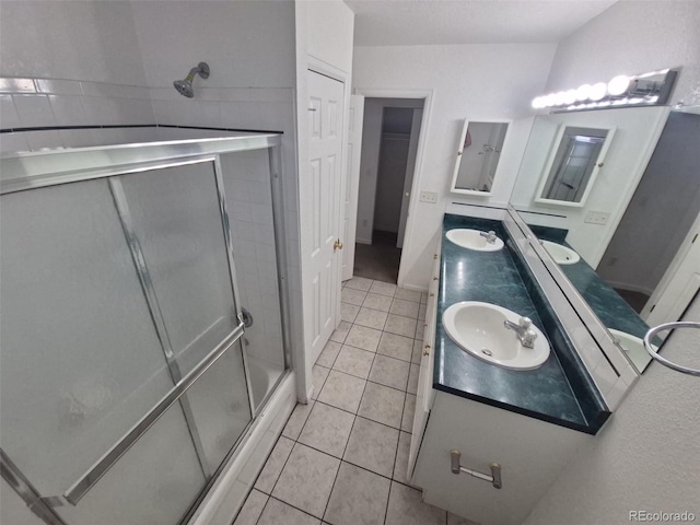 894 S Krameria St, Denver, CO 80224 - bathroom featuring double vanity, a stall shower, and tile patterned flooring