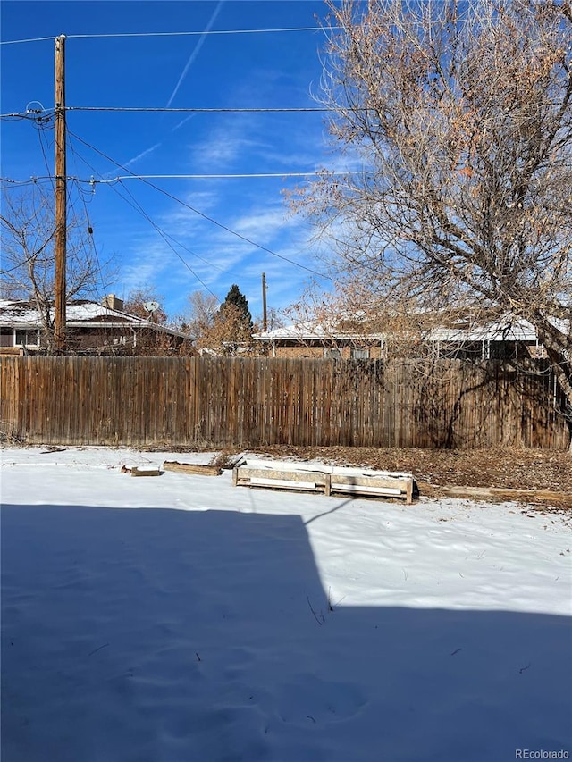 view of yard covered in snow