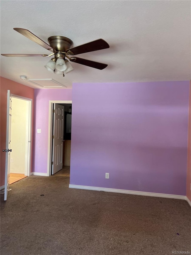 carpeted empty room featuring ceiling fan