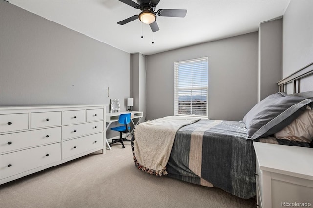 bedroom with light carpet and a ceiling fan