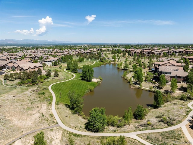 birds eye view of property with a water view and a residential view