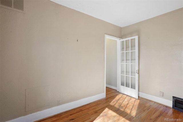 unfurnished room featuring light hardwood / wood-style floors