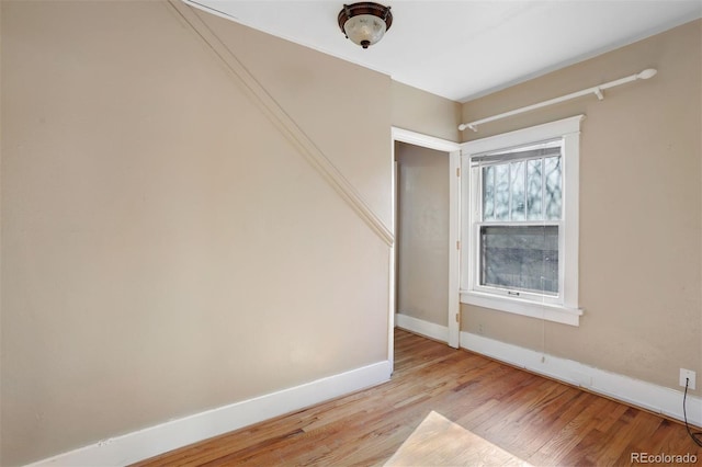 unfurnished room with light wood-type flooring