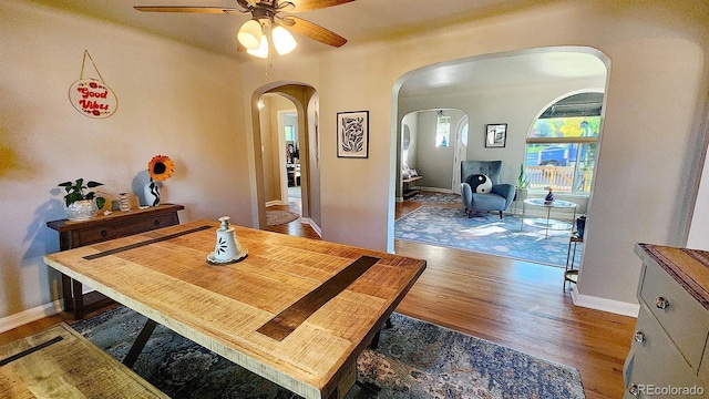 dining area featuring hardwood / wood-style flooring and ceiling fan