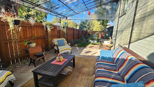 view of patio with an outdoor hangout area and a pergola