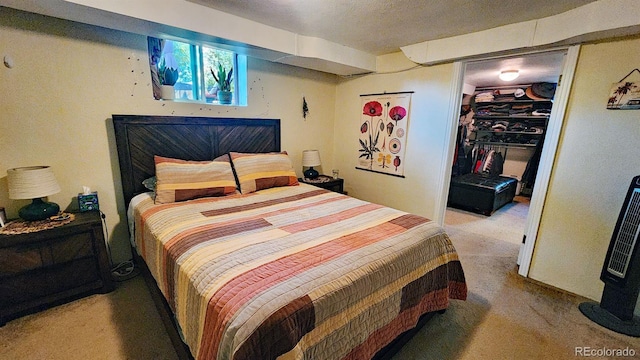 carpeted bedroom with a closet