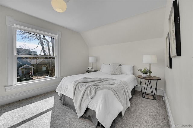 bedroom with baseboards, carpet flooring, and vaulted ceiling