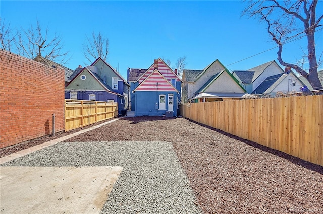 view of yard with a residential view and fence