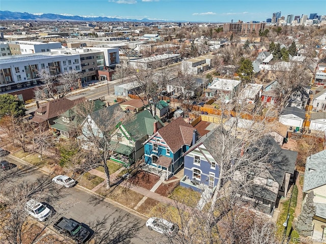 birds eye view of property with a mountain view and a city view