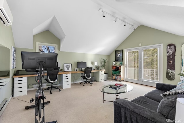 home office featuring a wall unit AC, rail lighting, carpet floors, and vaulted ceiling