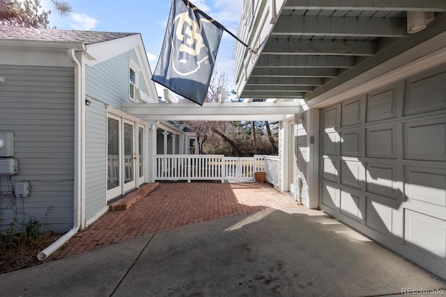 view of patio featuring a garage