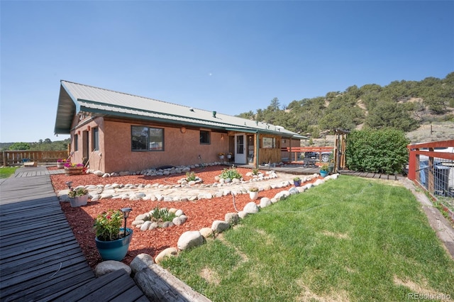 24700 US Highway 285, Buena Vista, CO 81211 - rear view of property with a metal roof and stucco siding