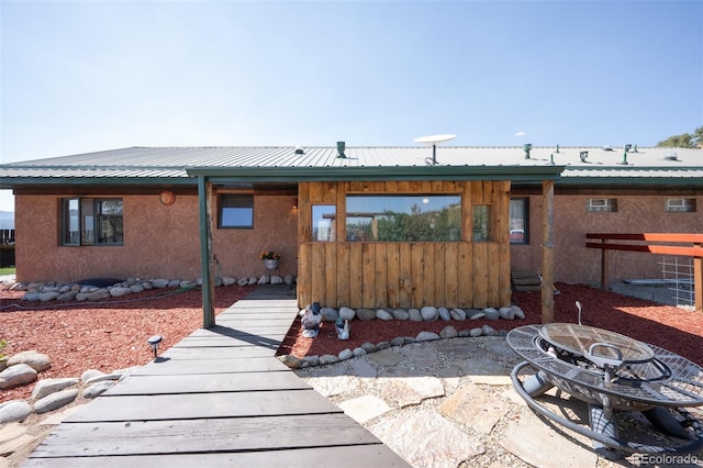24700 US Highway 285, Buena Vista, CO 81211 - view of front facade with an outdoor fire pit and a metal roof