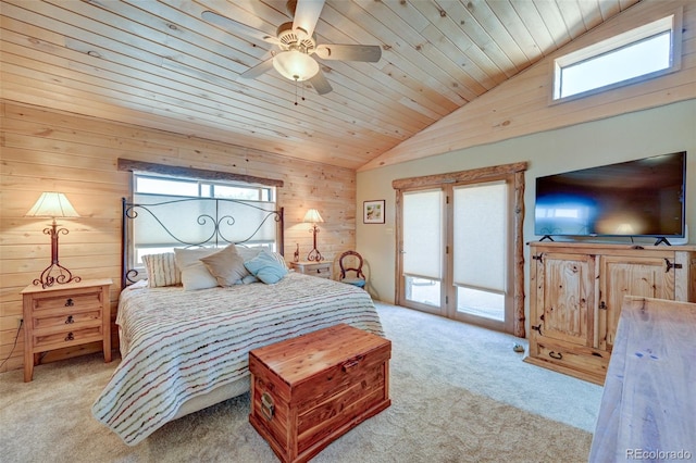 24700 US Highway 285, Buena Vista, CO 81211 - bedroom featuring lofted ceiling, light colored carpet, multiple windows, wood walls, and access to exterior
