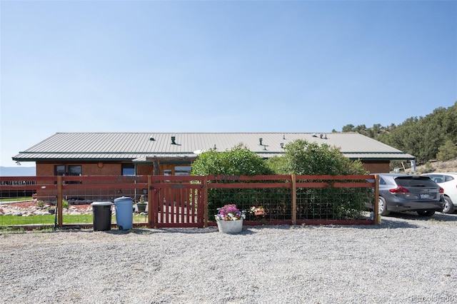 24700 US Highway 285, Buena Vista, CO 81211 - view of front of home featuring a metal roof and a gate