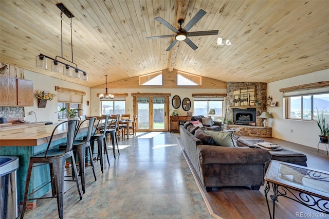 24700 US Highway 285, Buena Vista, CO 81211 - living room featuring a ceiling fan, lofted ceiling, a fireplace, wooden ceiling, and a chandelier