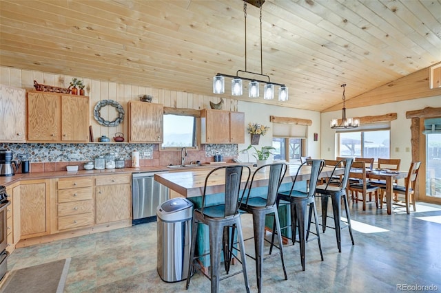 24700 US Highway 285, Buena Vista, CO 81211 - kitchen featuring appliances with stainless steel finishes, decorative backsplash, light brown cabinetry, a chandelier, and lofted ceiling