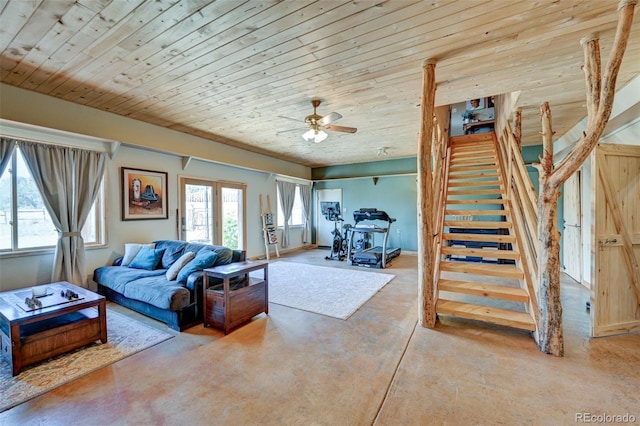 24700 US Highway 285, Buena Vista, CO 81211 - living room featuring concrete flooring, stairway, a ceiling fan, and wood ceiling