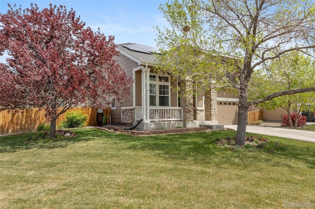 view of property hidden behind natural elements featuring solar panels, stone siding, concrete driveway, and a porch
