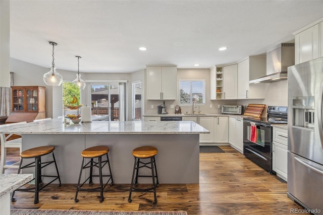 kitchen featuring stainless steel fridge with ice dispenser, black electric range, wall chimney exhaust hood, white cabinets, and open shelves