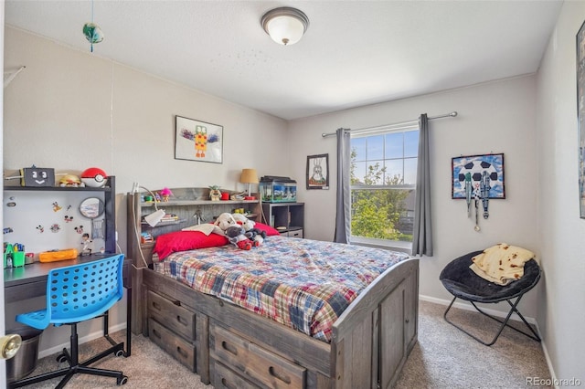 bedroom with carpet and baseboards