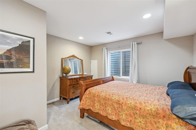 bedroom featuring light colored carpet, baseboards, and recessed lighting