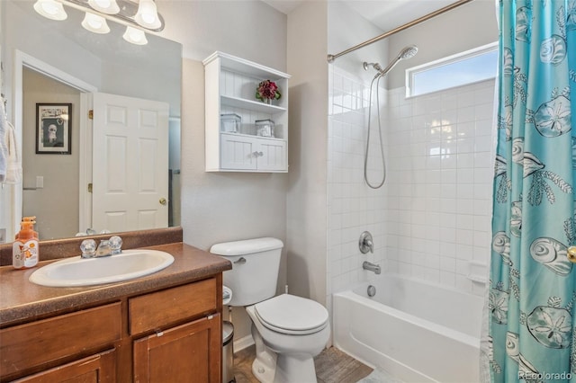 bathroom with shower / tub combo, toilet, and vanity