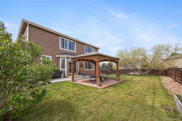back of house with a gazebo and a patio area