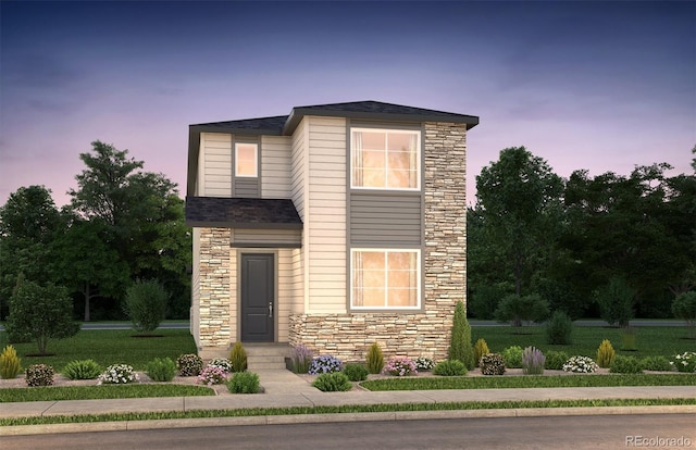 21166 E 62nd Dr, Aurora, CO 80019 - traditional home featuring stone siding and a lawn