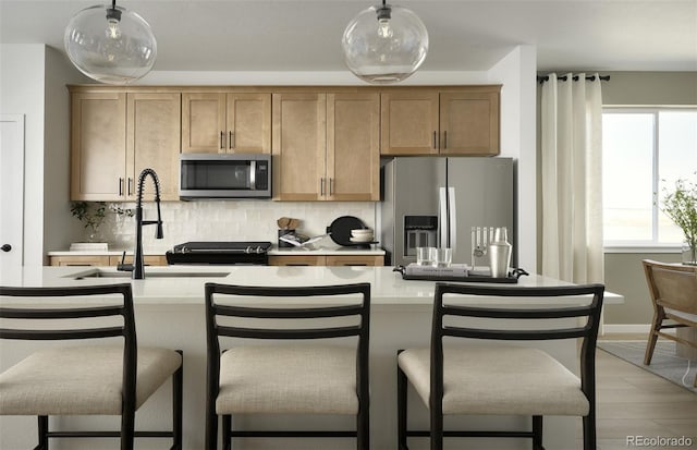 21166 E 62nd Dr, Aurora, CO 80019 - kitchen with stainless steel appliances, tasteful backsplash, healthy amount of natural light, and light countertops