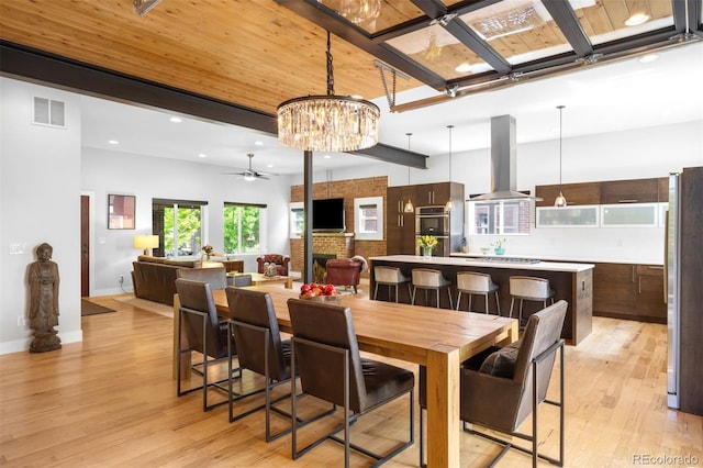 2669 N Cherry St, Denver, CO 80207 - dining space with light wood-style flooring, ceiling fan, recessed lighting, baseboards, and a chandelier