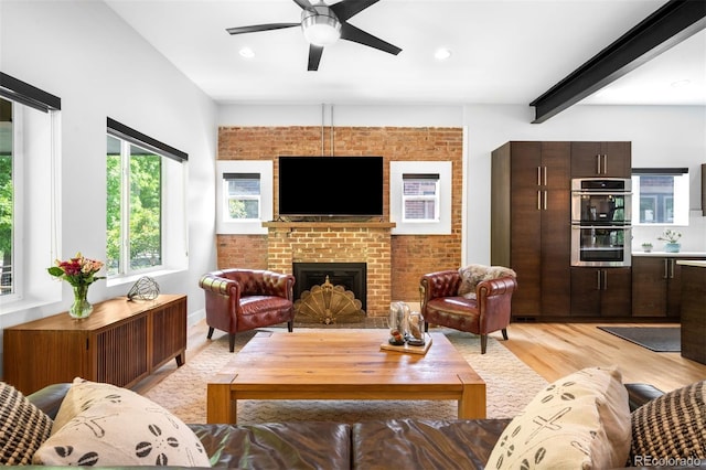 2669 N Cherry St, Denver, CO 80207 - living room featuring light wood finished floors, a ceiling fan, a fireplace, beamed ceiling, and recessed lighting