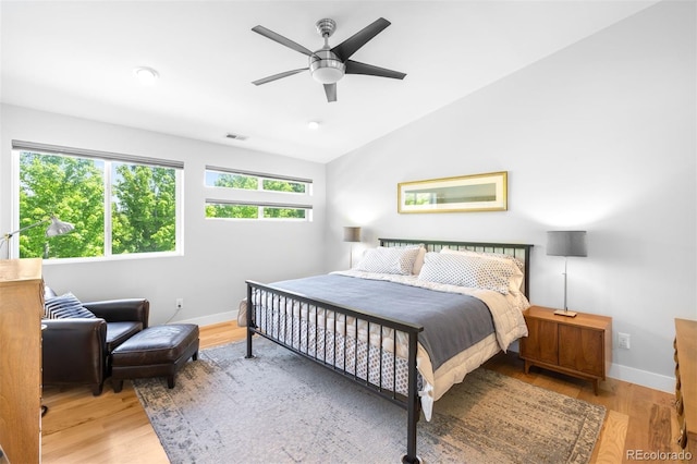 2669 N Cherry St, Denver, CO 80207 - bedroom featuring baseboards, wood finished floors, lofted ceiling, and a ceiling fan