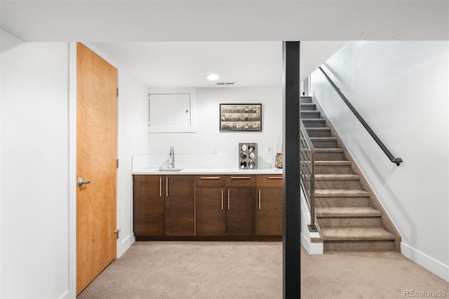 2669 N Cherry St, Denver, CO 80207 - indoor wet bar with light colored carpet, stairway, baseboards, and recessed lighting