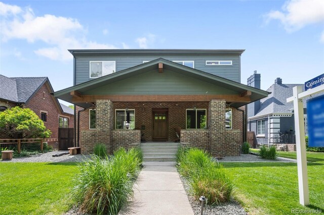 2669 N Cherry St, Denver, CO 80207 - view of front of house featuring a porch and brick siding