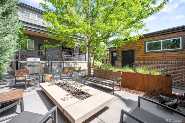 2669 N Cherry St, Denver, CO 80207 - view of patio / terrace featuring an outdoor living space with a fire pit and area for grilling