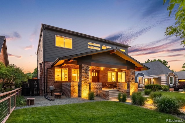 2669 N Cherry St, Denver, CO 80207 - back of house featuring brick siding and covered porch