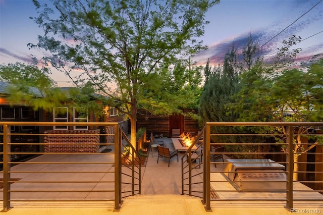 2669 N Cherry St, Denver, CO 80207 - wooden terrace featuring a fire pit