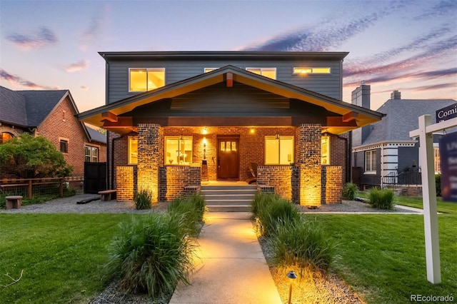 2669 N Cherry St, Denver, CO 80207 - view of front facade with a porch and brick siding