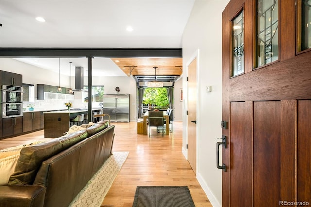 2669 N Cherry St, Denver, CO 80207 - living room with light wood-type flooring, recessed lighting, and baseboards