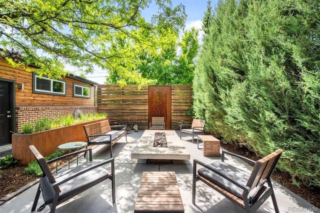 2669 N Cherry St, Denver, CO 80207 - view of patio with an outdoor living space with a fire pit
